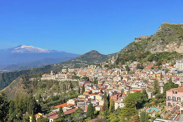 View of Taormina and mount Etna in the distance, Taormina, Sicily, Italy