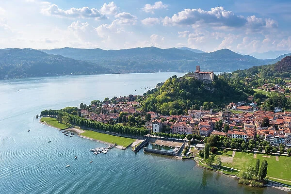 View of the town of Angera and its fortress called Rocca di Angera on a spring day. Angera, Lake Maggiore, Varese district, Lombardy, Italy