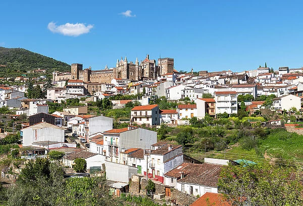 View towards town of Guadalupe and the Royal Monastery of Saint Mary of Guadalupe (Real Monasterio de Santa Maria de Guadalupe), a Roman Catholic monastic establishment built during the 14th century, Extremadura, Caceres, Spain