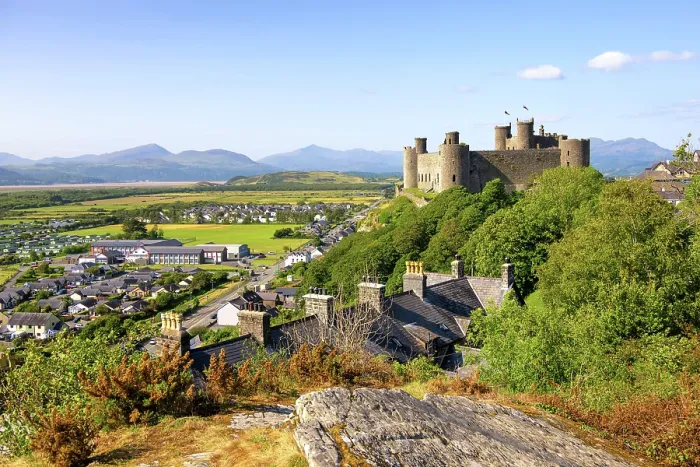 Framed Print : Views towards Harlech Castle (Castell Harlech) and village, with the mountain peaks of Eryri (Snowdonia) National Park in the background, Harlech, Gwynedd, Wales Framed Print : Views towards Harlech Castle (Castell Harlech) and village, with the mountain peaks of Eryri (Snowdonia) National Park in the background, Harlech, Gwynedd, Wales