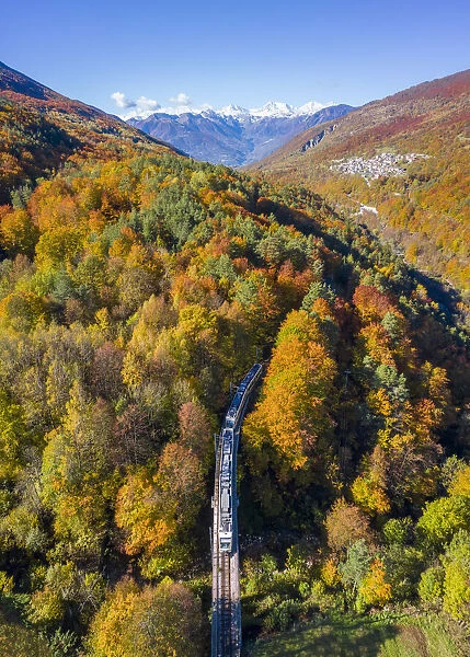 The Vigezzina-Centovalli train passes over a bridge near Gagnone-Orcesco