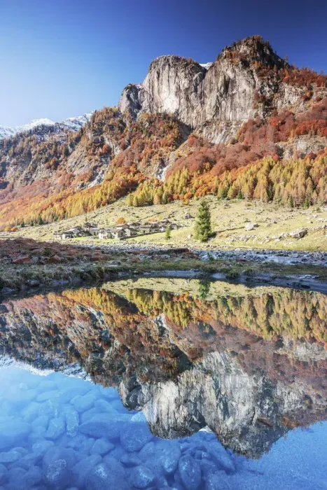Framed Print : Village of Corte Terza and mountains is reflected in a clear puddle in autumn Framed Print : Village of Corte Terza and mountains is reflected in a clear puddle in autumn