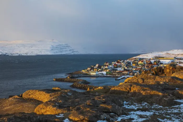 Framed Print : The village of Nolsoy covered by snow. Nolsoy, Faroe Islands