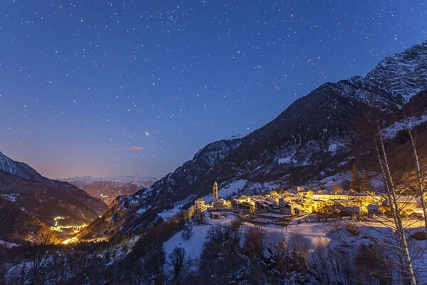 The village of Soglio in starry nigth after a heavy snowfall, val Bregaglia, Grisons