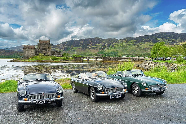 Vintage cars parked at Eilean Donan Castle, Scottish Highlands, Scotland, UK