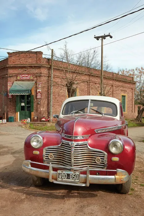 Framed Print : A vintage Chrysler car in front of a historical building of the Uribelarrea town, Buenos Aires province, Argentina Framed Print : A vintage Chrysler car in front of a historical building of the Uribelarrea town, Buenos Aires province, Argentina