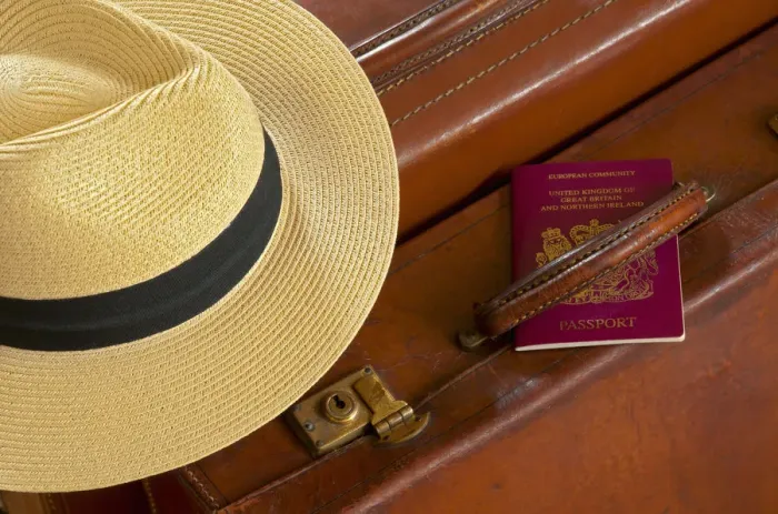 Framed Print : Vintage Leather Suitcase with Panama Hat and British Passport Framed Print : Vintage Leather Suitcase with Panama Hat and British Passport