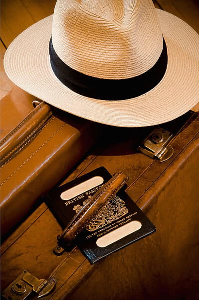 Vintage Leather Suitcase with Panama Hat and old style British Passport