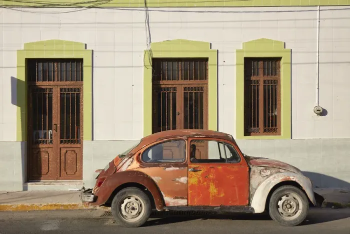 Framed Print : A vintage Volkswagen Beetle in front of a house in Merida, Yucatan, Mexico