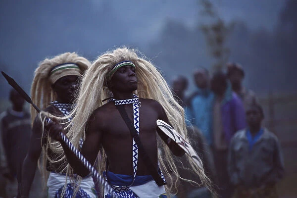 Virunga, Rwanda. Traditional Intore dancers perform at the foot of the Volcanoes National