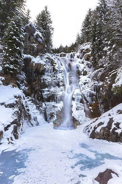Vo waterfall near Schilpario iced in winter. Val di Scalve, Bergamo province