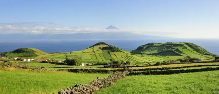 Framed Print : Volcanic craters along the Sao Jorge island and the Pico volcano on the horizon