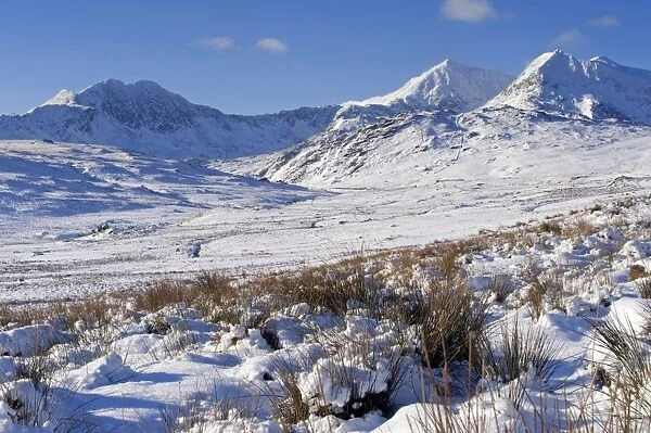 Wales, Gwynedd, Snowdonia. View over the frozen landscape towards the Snowdon Horseshoe