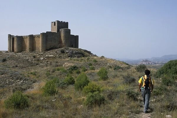 A walker approaches the 13th Century Castillo de Davalillo