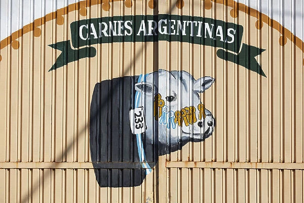 A wall art of an Argentine cow painted on the door of a building in Puerto Iguazu, Misiones, Argentina