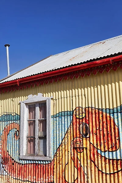 Wall art paintings over the exterior facade of the 'Alma Patagonica'restaurant in the town of Camarones, Chubut, Patagonia, Argentina
