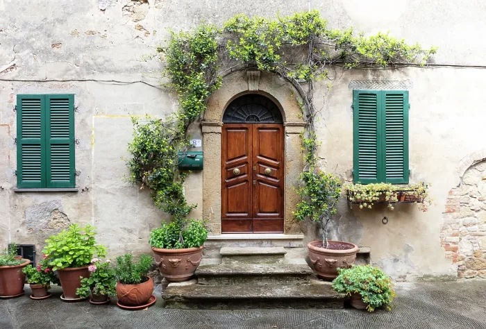 Framed Print : Wall of old house with heavy wooden door, green shutters and potted plants, Montisi, Montalcino, Province of Siena, Tuscany, Italy Framed Print : Wall of old house with heavy wooden door, green shutters and potted plants, Montisi, Montalcino, Province of Siena, Tuscany, Italy