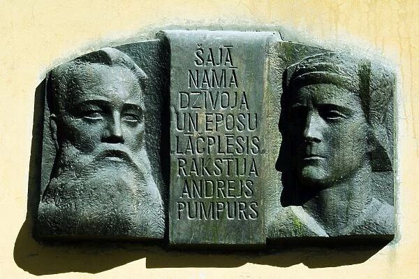 Wall Plaque with Face Carvings