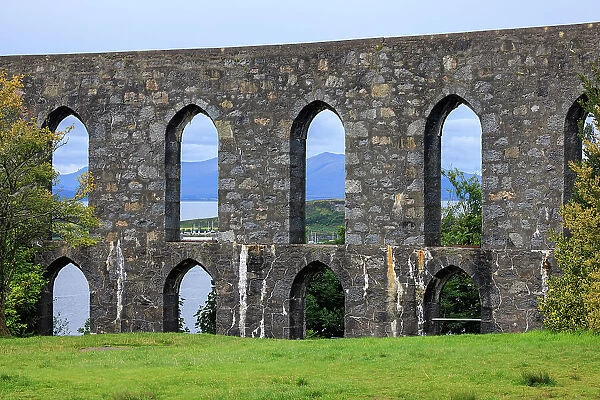 The Walls of McCaig's Tower on Battery Hill overlooking Oban with the Scoittish Highlands beyond, Oban, Scotland, UK