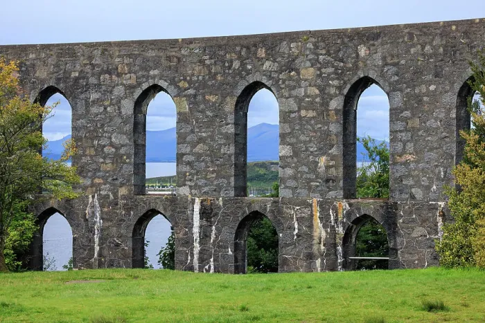 Framed Print : The Walls of McCaig's Tower on Battery Hill overlooking Oban with the Scoittish Highlands beyond, Oban, Scotland, UK Framed Print : The Walls of McCaig's Tower on Battery Hill overlooking Oban with the Scoittish Highlands beyond, Oban, Scotland, UK
