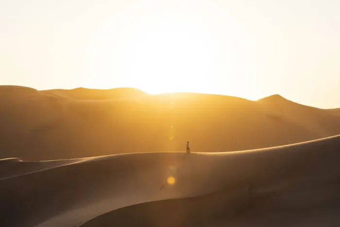 Framed Print : Walvis Bay, Namibia, Africa. Man walking on the sand dunes at sunset Framed Print : Walvis Bay, Namibia, Africa. Man walking on the sand dunes at sunset