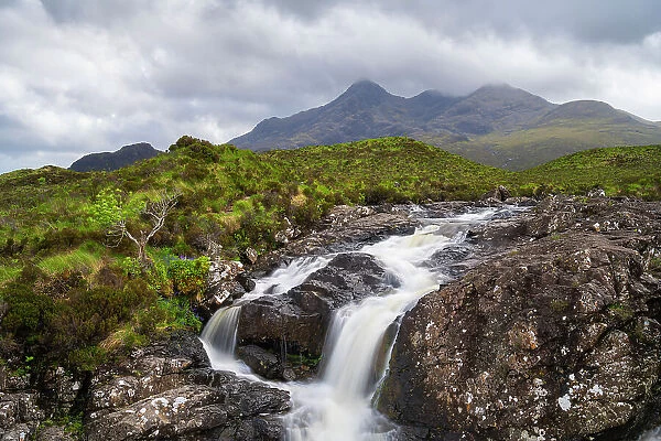 Waterfall against Cuillin mountain range on Allt Dearg Mor stream, near Sligachan, Isle of Skye, Scottish Highlands, Scotland, UK