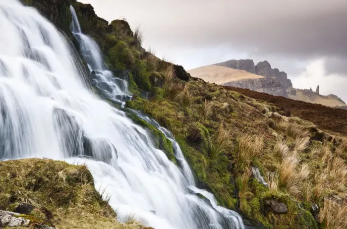 Framed Print : A waterfall with the Old Man of Storr in the background, Isle of Skye, Scotland, UK Framed Print : A waterfall with the Old Man of Storr in the background, Isle of Skye, Scotland, UK