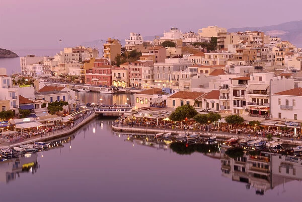 Waterfront at sunset in Agios Nikolaos, Crete, Greece, Europe