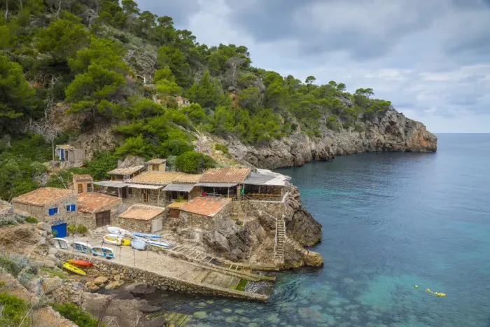 Framed Print : Waterside restaurant, Cala De Deia, Serra de Tramuntana (a location in the BBC drama Framed Print : Waterside restaurant, Cala De Deia, Serra de Tramuntana (a location in the BBC drama