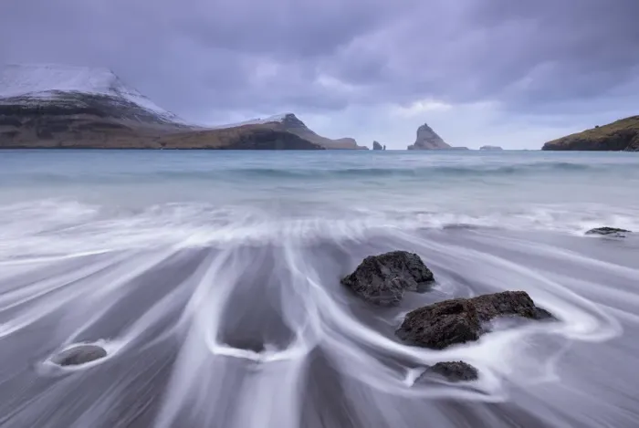 Framed Print : Waves crash onto the black sandy beach at Bour on the island of Vagar in the Faroe Islands, Denmark, Europe. Winter (March) 2015 Framed Print : Waves crash onto the black sandy beach at Bour on the island of Vagar in the Faroe Islands, Denmark, Europe. Winter (March) 2015