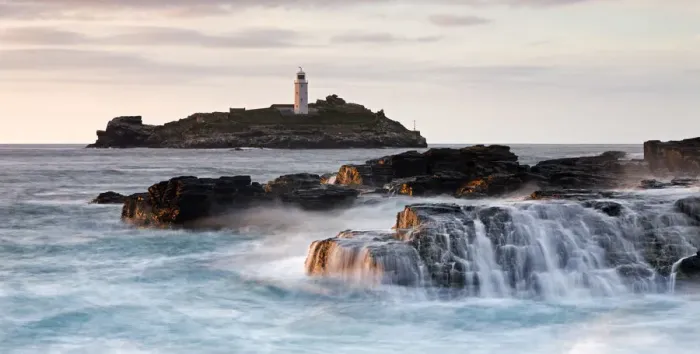 Framed Print : Waves crash over the rocks at Godrevy Point, looking out towards the lighthouse Framed Print : Waves crash over the rocks at Godrevy Point, looking out towards the lighthouse