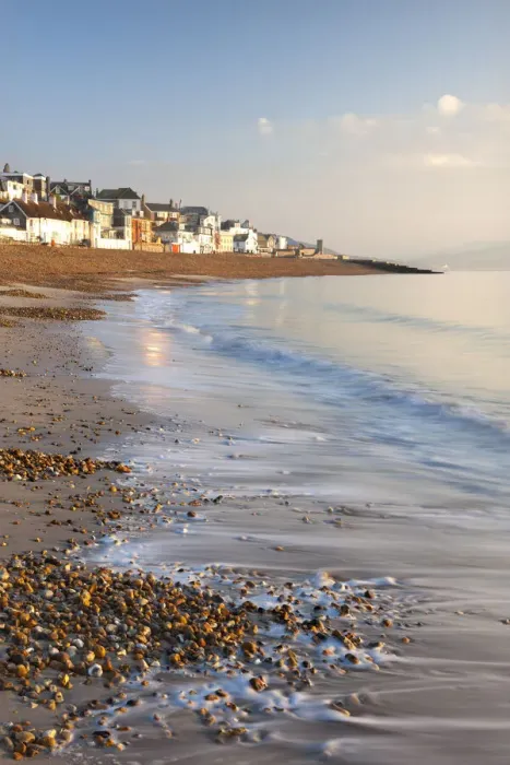 Framed Print : Waves lap onto the shores of Lyme Regis beach on the Jurassic Coast, Lyme Regis, Dorset, England. Winter (December) 2010 Framed Print : Waves lap onto the shores of Lyme Regis beach on the Jurassic Coast, Lyme Regis, Dorset, England. Winter (December) 2010