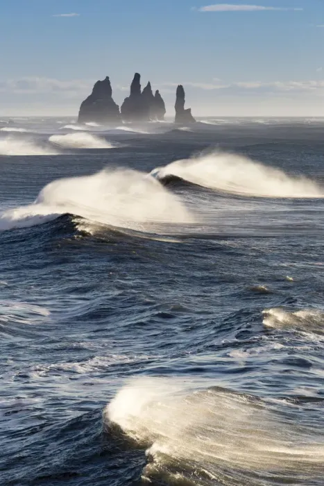 Framed Print : Waves moving to Reynisfjara beach, with the Reynisdrangar sea stacks on the horizon