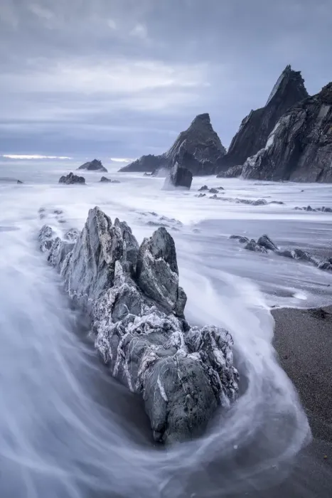 Framed Print : Waves sweep onto the rocky beach on a stormy evening at Westcombe Bay, Devon, England Framed Print : Waves sweep onto the rocky beach on a stormy evening at Westcombe Bay, Devon, England