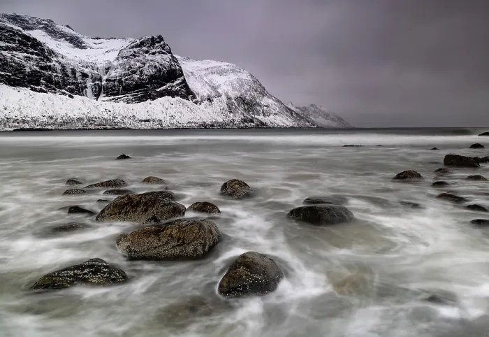Framed Print : Waves washing over rocks on the beach at Ersfjord, Senja island, Troms county, Norway Framed Print : Waves washing over rocks on the beach at Ersfjord, Senja island, Troms county, Norway