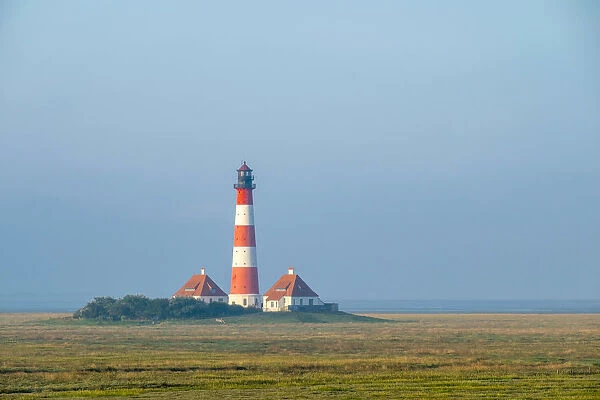 Westerhever Lighthouse at sunrise, built in 1906, Westerhever, Nordfriesland