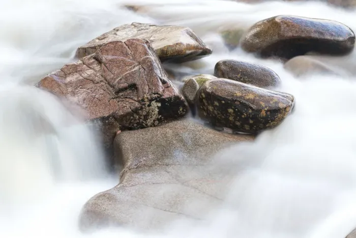 Framed Print : Detail of wet rocks in flowing River Etive stream, Glen coe, Highland Region, Scotland