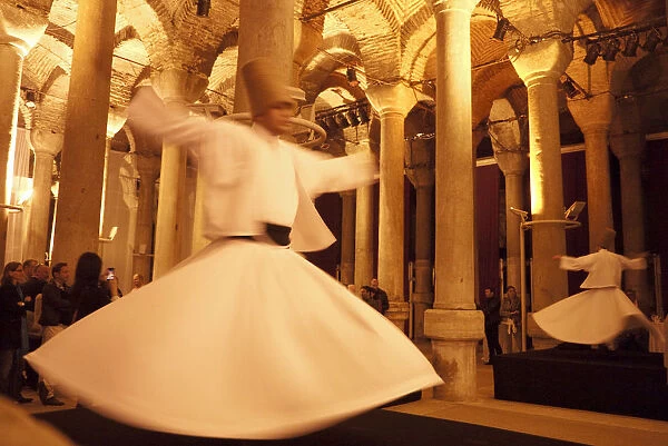 Whirling dervishes in the 1001 column cisterns, Istanbul, Turkey