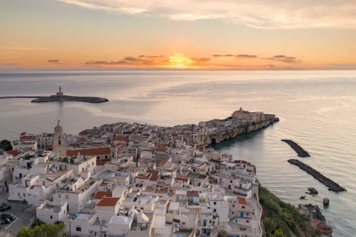Framed Print : White buildings by the sea at dawn, aerial view, Vieste, Foggia province