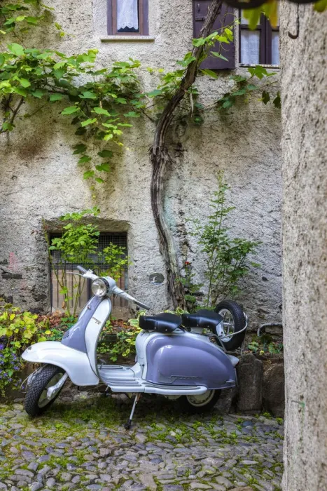 Framed Print : White and grey Lambretta Innocenti scooter in a courtyard, Morbegno, province of Sondrio Framed Print : White and grey Lambretta Innocenti scooter in a courtyard, Morbegno, province of Sondrio