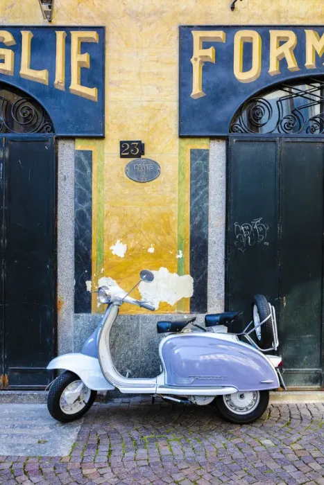 Framed Print : White and grey Lambretta Innocenti scooter parked at the old grocery, Morbegno, Sondrio