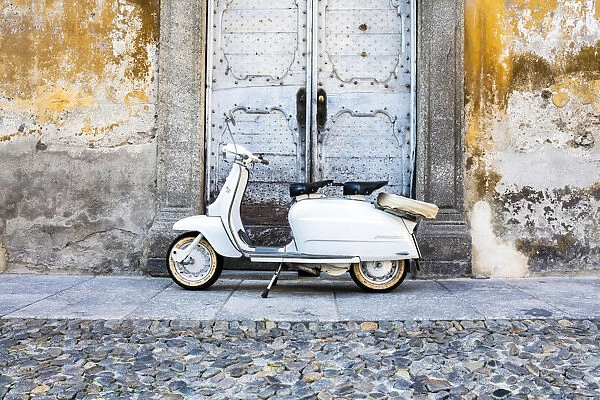 White Lambretta Innocenti scooter in the old town, Morbegno, province of Sondrio