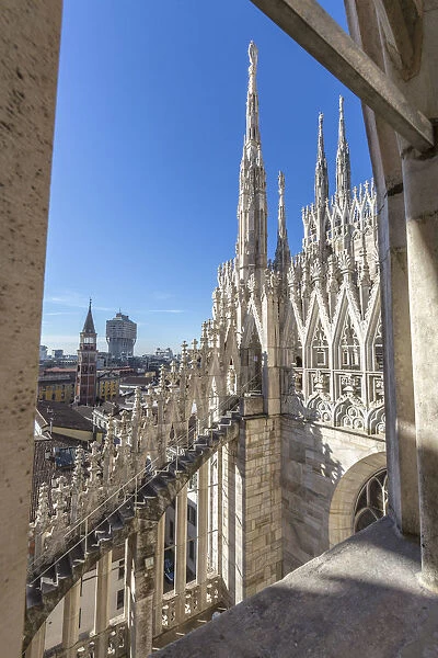 The white marble spiers on the top of the Duomo Milan Lombardy Italy Europe