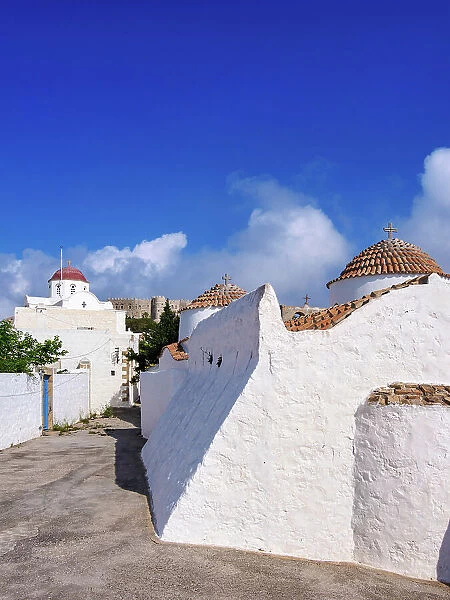 Whitewashed churches of Patmos Chora, Monastery of Saint-John the Theologian in the background, Patmos Island, Dodecanese, Greece