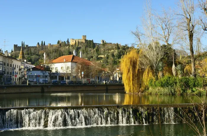 Framed Print : A willow tree over the Nabao river and the Templar castle on the top of the hill. Tomar Framed Print : A willow tree over the Nabao river and the Templar castle on the top of the hill. Tomar