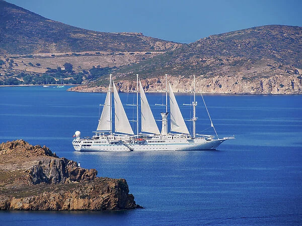 Wind Star 4-masted motor sailing Yacht by the coast of Patmos Island, Dodecanese, Greece