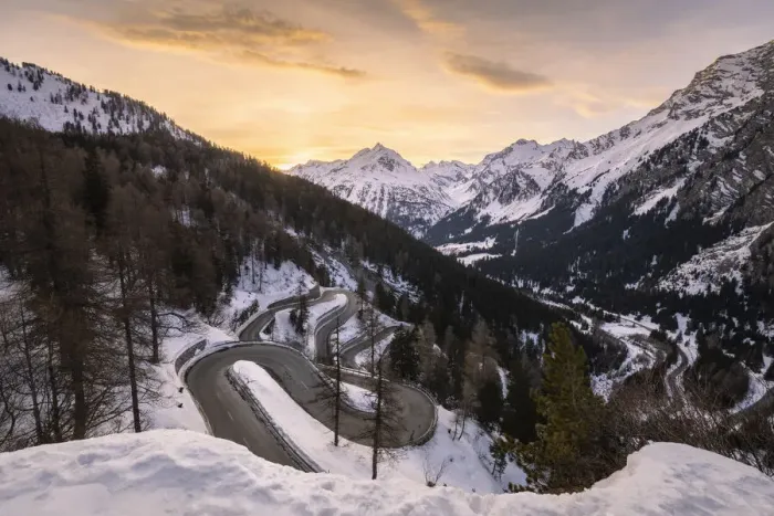 Framed Print : The winding curves of Maloja Pass road in winter at sunset, Bregaglia Valley, canton of Graubunden, Engadin, Switzerland Framed Print : The winding curves of Maloja Pass road in winter at sunset, Bregaglia Valley, canton of Graubunden, Engadin, Switzerland