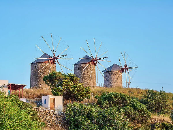 Windmills of Patmos Chora at sunset, Patmos Island, Dodecanese, Greece