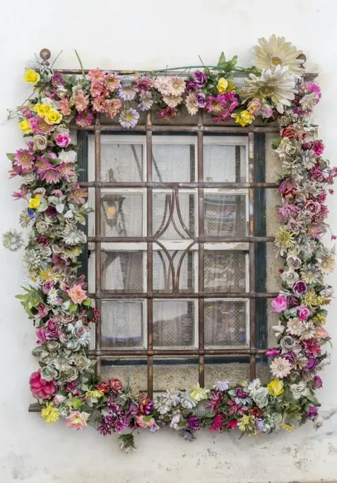 Framed Print : A window adorned with colorful flowers in the ancient fortified town of Obidos Oeste