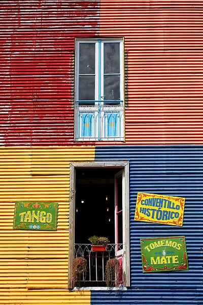 Windows of a colorful bar in the 'Caminito de La Boca'with wall decorations in 'Fileteado Art', Buenos Aires, Argentina